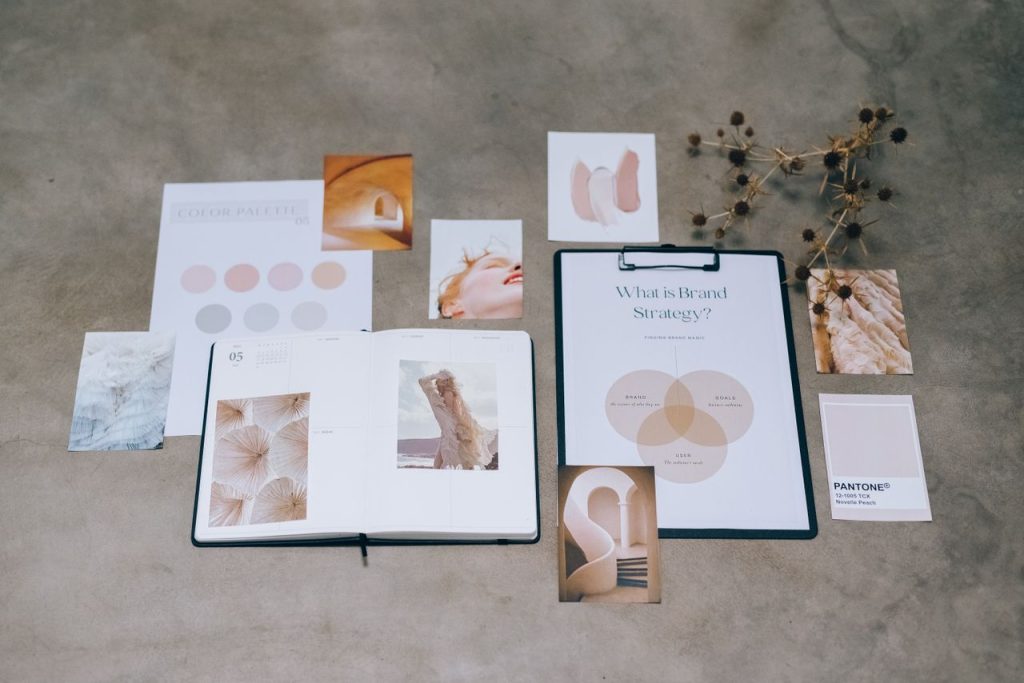 Mastering the First Impression: Your intriguing post title goes here A flat lay of branding elements with color palettes and strategic planning documents on a concrete surface.